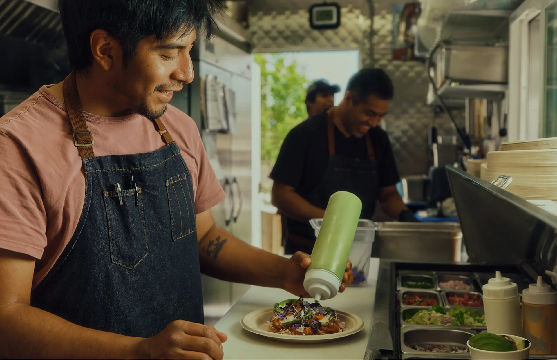 Dos Mundos food truck, fresh ingredients neatly arranged nearby.