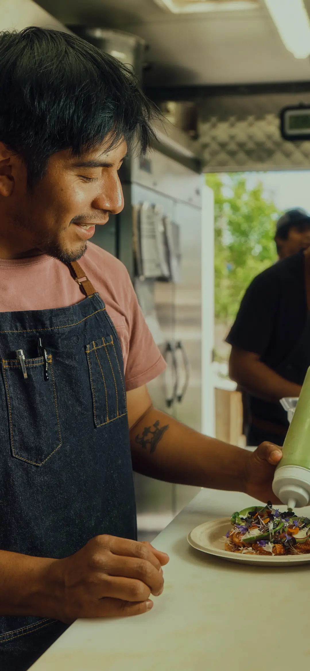 Dos Mundos food truck, fresh ingredients neatly arranged nearby.