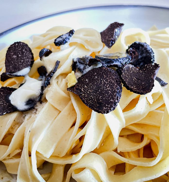 Fettuccine alfredo dish with truffles