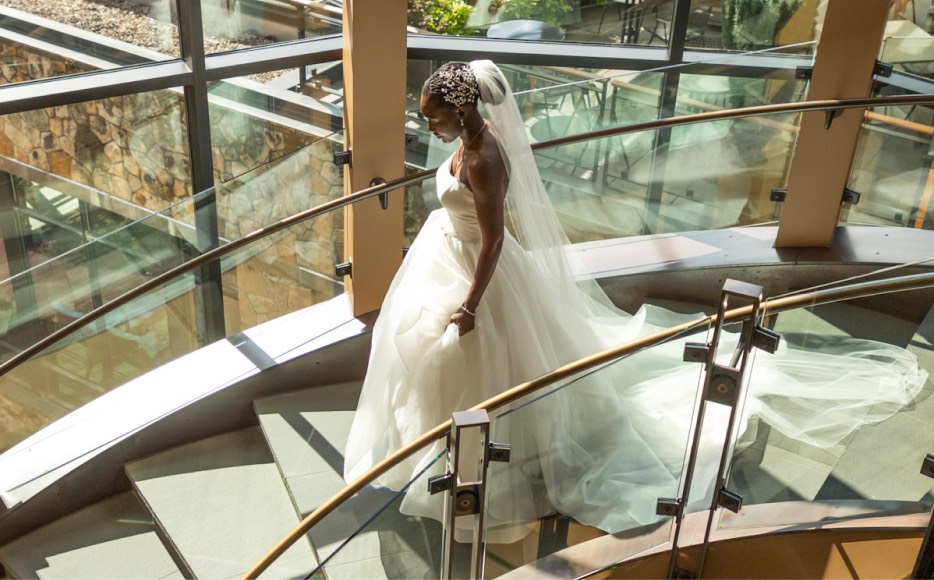 Bride walking down spiral stairs at a Newberg event center