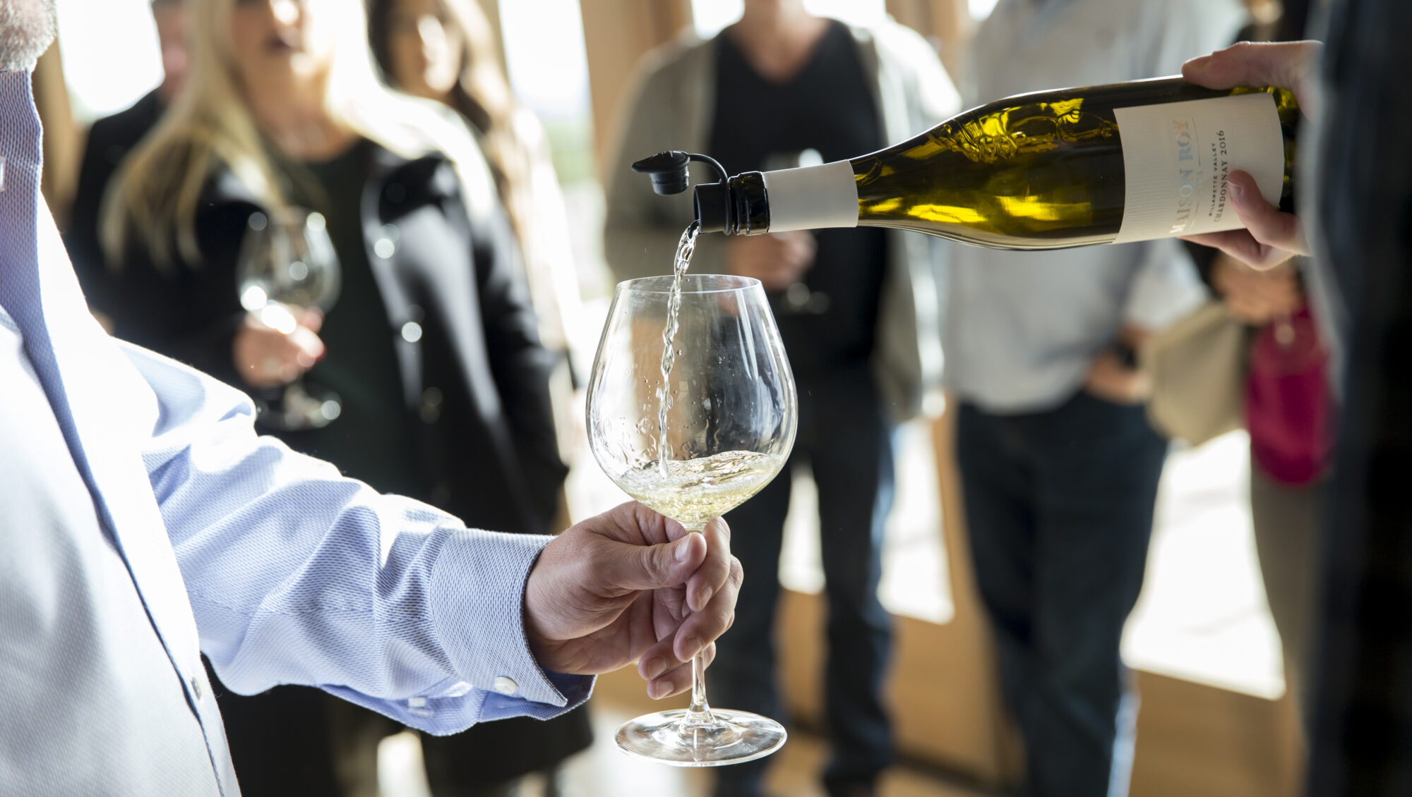 Pouring Chardonnay at Domaine Roy